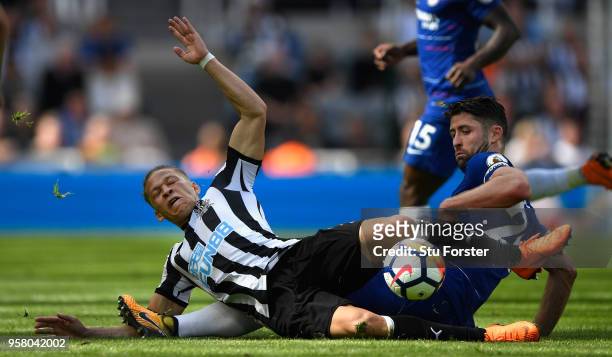 Chesea defender Gary Cahill fouls Dwight Gayle of Newcastle during the Premier League match between Newcastle United and Chelsea at St. James Park on...