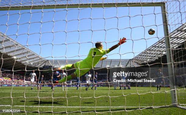 Jack Butland of Stoke City dives to make a save during the Premier League match between Swansea City and Stoke City at Liberty Stadium on May 13,...