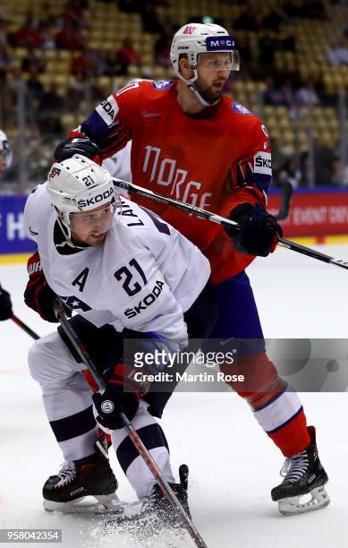 Daniel Sorvik of Norway and Dylan Larkin of United States battle for position during the 2018 IIHF Ice Hockey World Championship Group B game between...