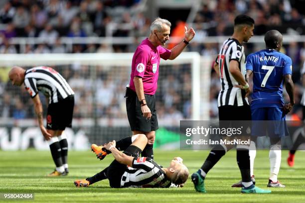 Dwight Gayle of Newcastle United goes down injured during the Premier League match between Newcastle United and Chelsea at St. James Park on May 13,...