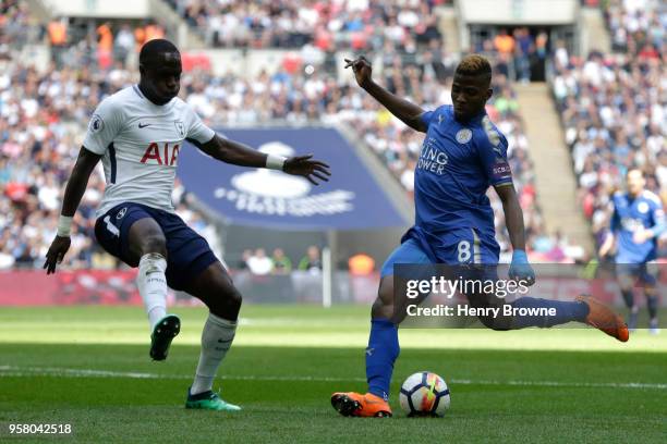 Kelechi Iheanacho of Leicester City shoots on goal under pressure from Moussa Sissoko of Tottenham Hotspur during the Premier League match between...