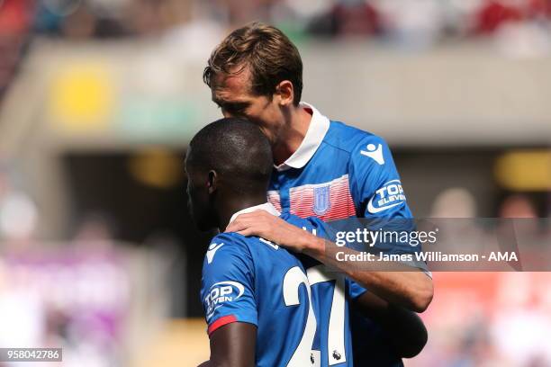 Badou Ndiaye of Stoke City celebrates after scoring a goal to make it 1-1 with Peter Crouch of Stoke City during the Premier League match between...