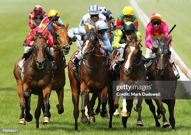 Jockey Mark Zahra riding Growl is narrowly beaten by Chris Symons riding Coppervue with Craig Newitt on Awimoweh third and Glen Boss on Dr Nipandtuck...