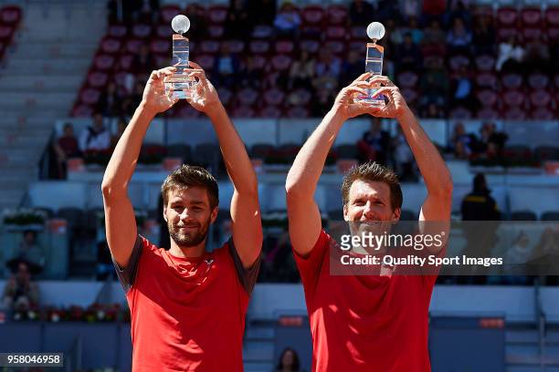 Nikola Mektic of Croatia and Alexander Peya of Austria with their trophies after winning his match against Bob Bryan of the United States and Mike...