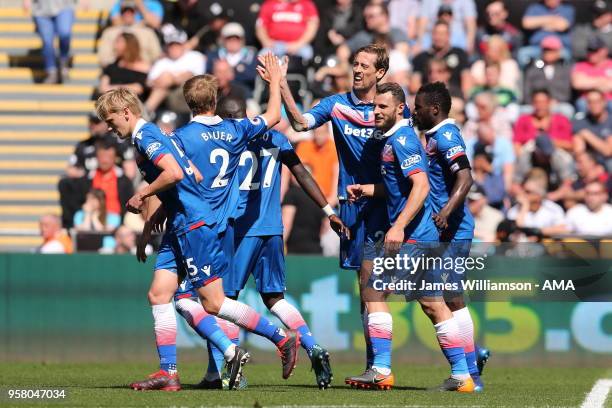 Peter Crouch of Stoke City celebrates after scoring a goal to make it 2-1 during the Premier League match between Swansea City and Stoke City at...