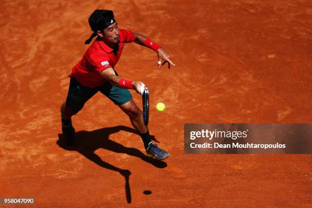 Yuichi Sugita of Japan returns a forehand in his match against Ryan Harrison of the USA during day one of the Internazionali BNL d'Italia 2018 tennis...