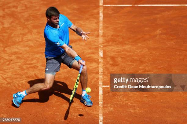 Ryan Harrison of the USA returns a forehand in his match against Yuichi Sugita of Japan during day one of the Internazionali BNL d'Italia 2018 tennis...