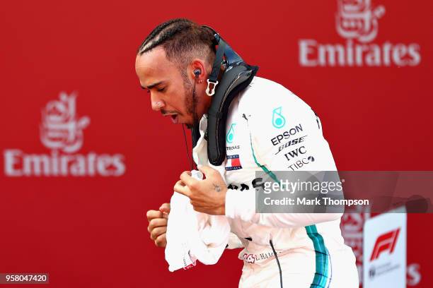 Race winner Lewis Hamilton of Great Britain and Mercedes GP celebrates in parc ferme during the Spanish Formula One Grand Prix at Circuit de...