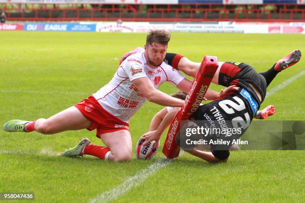 Liam Marshall of Wigan Warriors dives in to score a Try during round six of the Ladbrokes Challenge Cup at KCOM Craven Park on May 13, 2018 in Hull,...