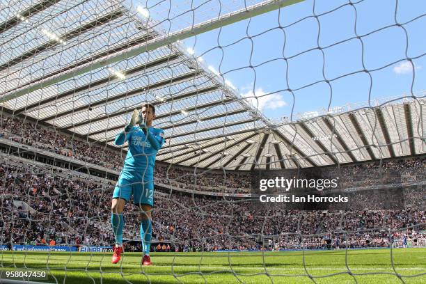 Newcastle keeper Martin Dubravka applauds the fans during the Premier League match between Newcastle United and Chelsea at St. James Park on May 13,...