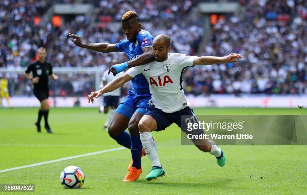 Kelechi Iheanacho of Leicester City battles for possession with Lucas Moura of Tottenham Hotspur during the Premier League match between Tottenham...