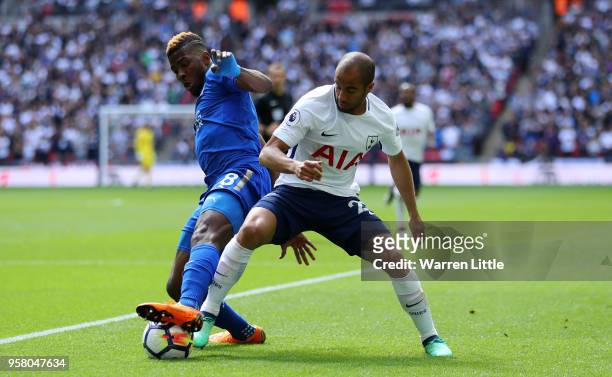 Kelechi Iheanacho of Leicester City battles for possession with Lucas Moura of Tottenham Hotspur during the Premier League match between Tottenham...
