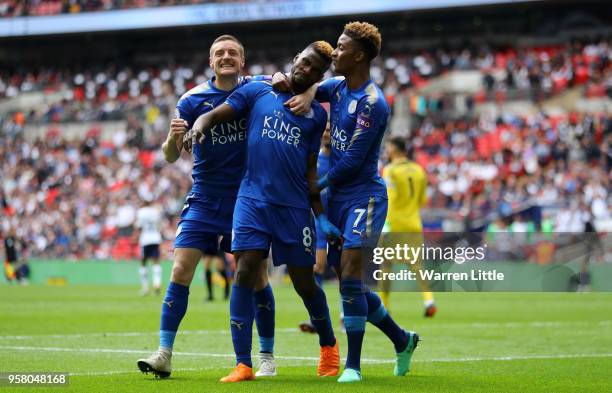 Kelechi Iheanacho of Leicester City celebrates with Jamie Vardy of Leicester City and Demarai Gray of Leicester City after scoring his sides third...