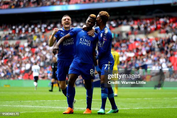 Kelechi Iheanacho of Leicester City celebrates with Jamie Vardy of Leicester City and Demarai Gray of Leicester City after scoring his sides third...