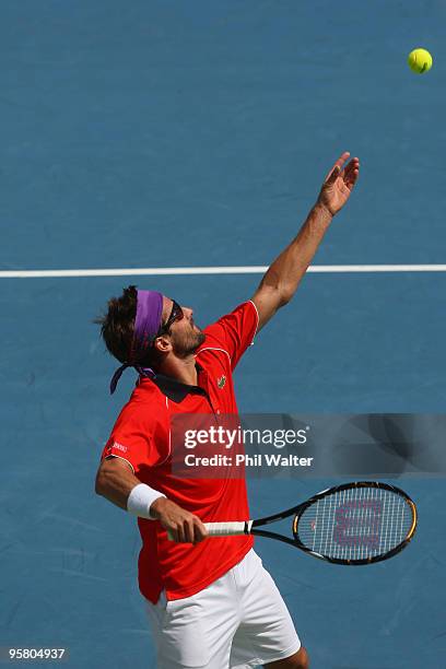 Arnaud Clement of France serves in his final match against John Isner of the USA during day six of the Heineken Open at the ASB Tennis Centre on...