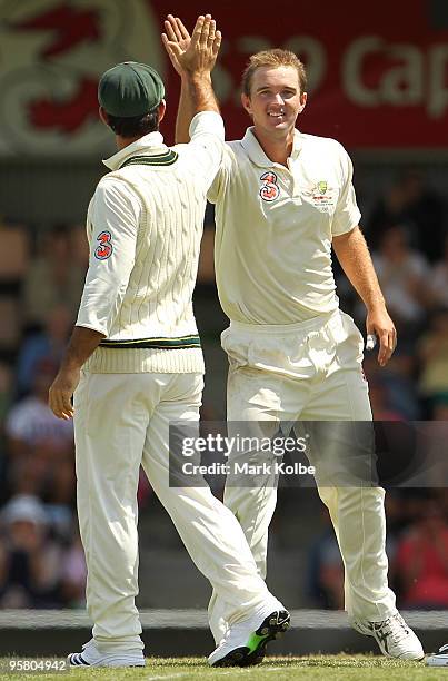 Ricky Ponting and Nathan Hauritz of Australia celebrate after taking the wicket of Danish Kaneria of Pakistan during day three of the Third Test...