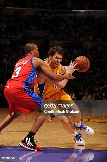 Luke Walton of the Los Angeles Lakers goes hard to the hoop against Sebastian Telfair of the Los Angeles Clippers at Staples Center on January 15,...