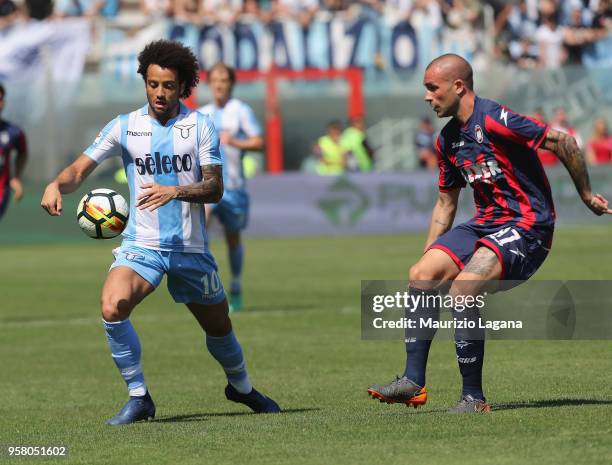 Bruno Martellaof Crotone competes for the ball with Felipe Anderson of Lazio during the serie A match between FC Crotone and SS Lazio at Stadio...