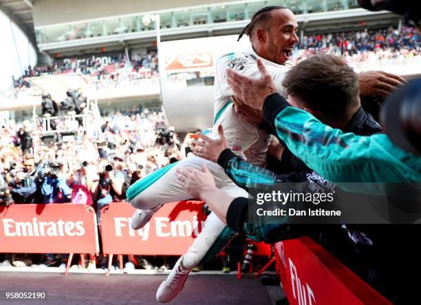Race winner Lewis Hamilton of Great Britain and Mercedes GP celebrates in parc ferme during the Spanish Formula One Grand Prix at Circuit de...