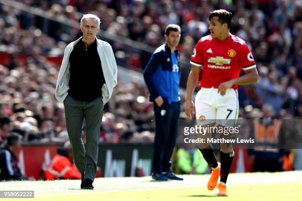 Jose Mourinho, Manager of Manchester United looks on as Alexis Sanchez of Manchester United looks on during the Premier League match between...