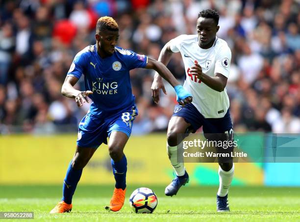 Kelechi Iheanacho of Leicester City and Victor Wanyama of Tottenham Hotspur battle for possession during the Premier League match between Tottenham...