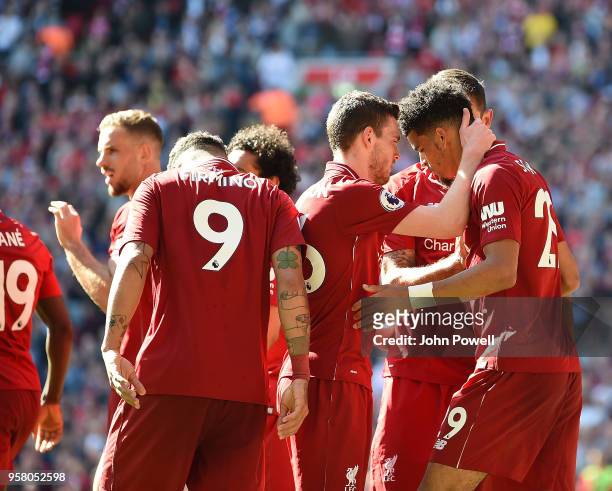 Dominic Solanke of Liverpool scores and celebrates the third goal during the Premier League match between Liverpool and Brighton and Hove Albion at...
