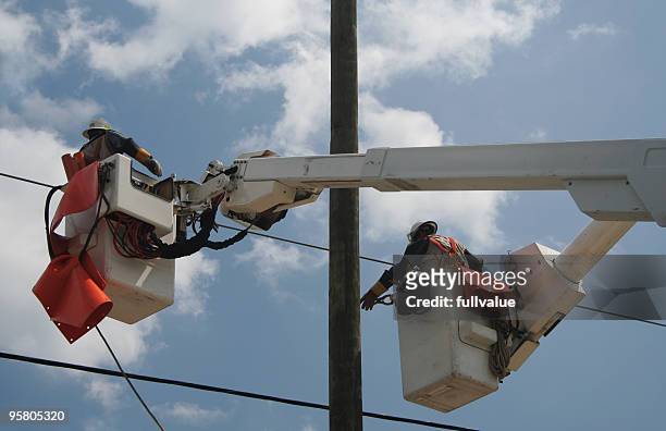 pulling the power lines - hurricane storm surge stock pictures, royalty-free photos & images