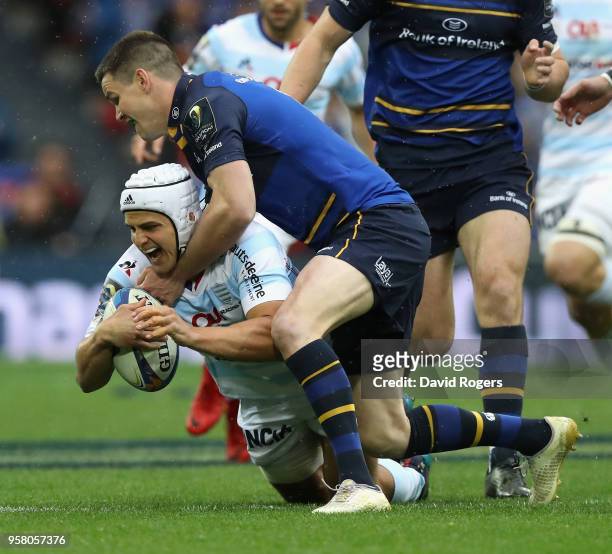 Pat Lambie of Racing 92 is tackled by Jonathan Sexton during the European Rugby Champions Cup Final match between Leinster Rugby and Racing 92 at San...