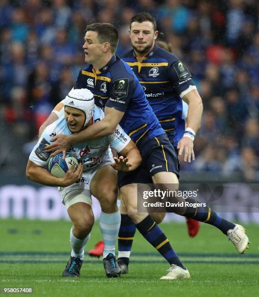 Pat Lambie of Racing 92 is tackled by Jonathan Sexton during the European Rugby Champions Cup Final match between Leinster Rugby and Racing 92 at San...