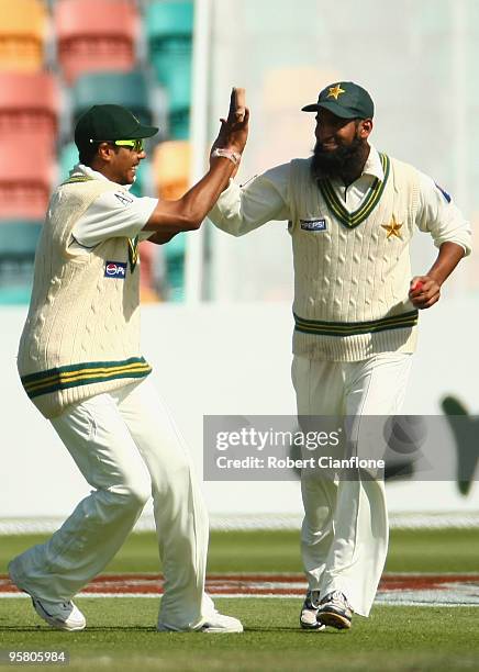 Mohammad Yousuf celebrates catching Shane Watson of Australia during day three of the Third Test match between Australia and Pakistan at Bellerive...