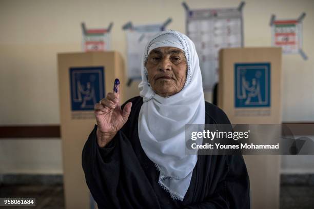 Voters head to polling stations to cast their vote for the Iraqi parliamentary election on May 12, 2018 in Erbil, Iraq. Citizens are voting in the...