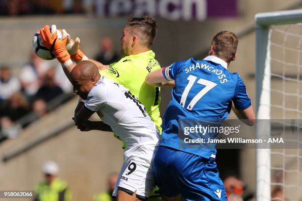 Jack Butland of Stoke City claims a cross ahead of Andre Ayew of Swansea Cityduring the Premier League match between Swansea City and Stoke City at...
