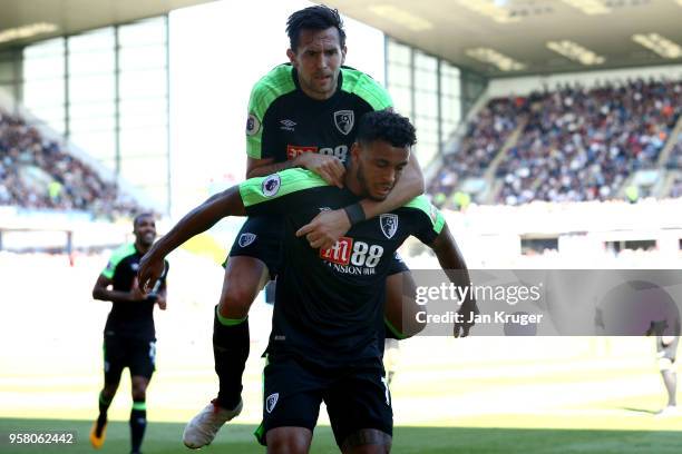 Joshua King of AFC Bournemouth celebrates with Charlie Daniels of AFC Bournemouth after scoring his sides first goal during the Premier League match...