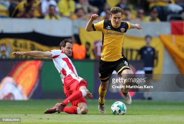 Niklas Hauptmann of Dresden battles for the ball with Stephan Fuerstner of Berlin during the Second Bundesliga match between SG Dynamo Dresden and...