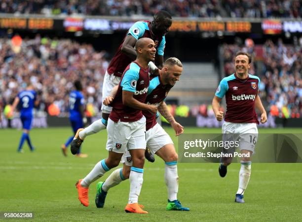 Marko Arnautovic of West Ham United celebrates with Joao Mario of West Ham United after scoring his sides second goal during the Premier League match...