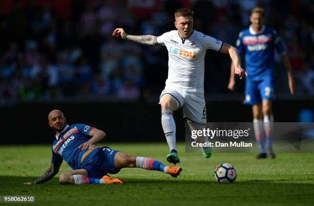 Stephen Ireland of Stoke City and Alfie Mawson of Swansea City battle for possession during the Premier League match between Swansea City and Stoke...