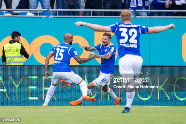 Tobias Kempe of Darmstadt celebrates his team's first goal with his team mates Terrence Boyd and Fabian Holland during the Second Bundesliga match...