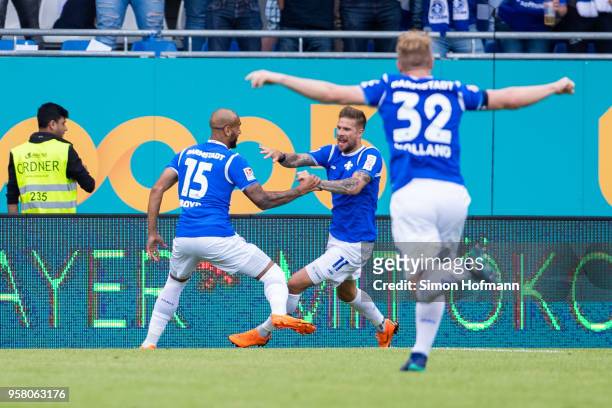 Tobias Kempe of Darmstadt celebrates his team's first goal with his team mates Terrence Boyd and Fabian Holland during the Second Bundesliga match...