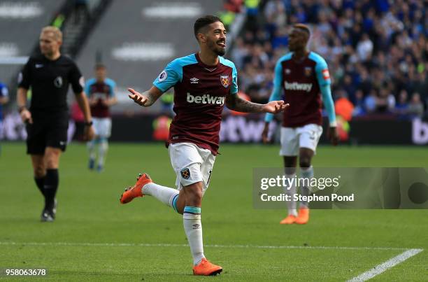 Manuel Lanzini of West Ham United celebrates scoring his sides third goal during the Premier League match between West Ham United and Everton at...