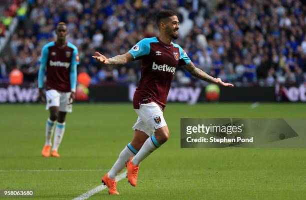 Manuel Lanzini of West Ham United celebrates scoring his sides third goal during the Premier League match between West Ham United and Everton at...