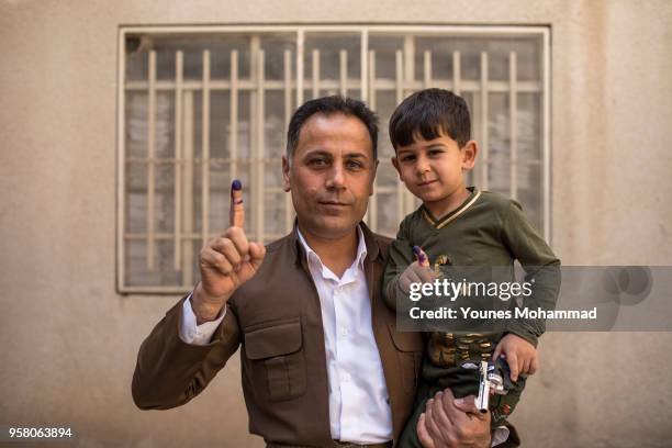 Voters head to polling stations to cast their vote for the Iraqi parliamentary election on May 12, 2018 in Erbil, Iraq. Citizens are voting in the...