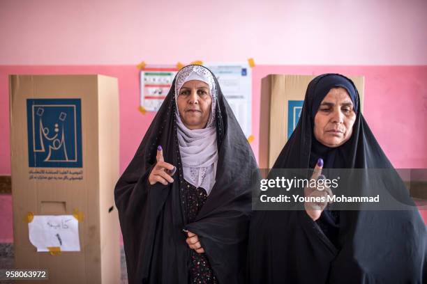 Voters head to polling stations to cast their vote for the Iraqi parliamentary election on May 12, 2018 in Erbil, Iraq. Citizens are voting in the...