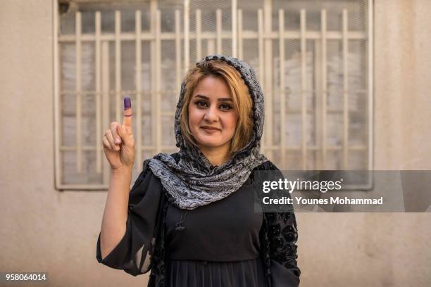 Voters head to polling stations to cast their vote for the Iraqi parliamentary election on May 12, 2018 in Erbil, Iraq. Citizens are voting in the...