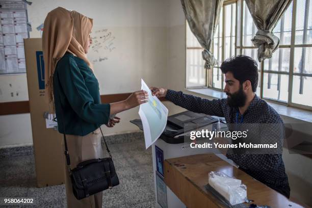 Voters head to polling stations to cast their vote for the Iraqi parliamentary election on May 12, 2018 in Erbil, Iraq. Citizens are voting in the...