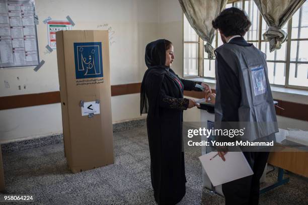 Voters head to polling stations to cast their vote for the Iraqi parliamentary election on May 12, 2018 in Erbil, Iraq. Citizens are voting in the...