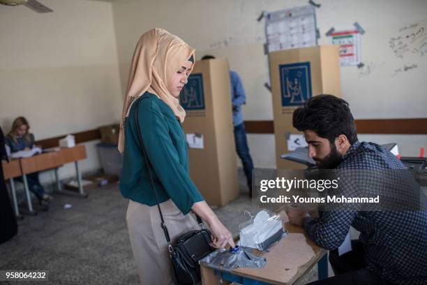 Voters head to polling stations to cast their vote for the Iraqi parliamentary election on May 12, 2018 in Erbil, Iraq. Citizens are voting in the...