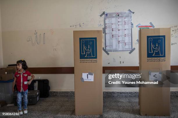 Voters head to polling stations to cast their vote for the Iraqi parliamentary election on May 12, 2018 in Erbil, Iraq. Citizens are voting in the...