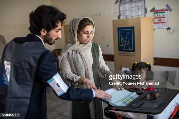Voters head to polling stations to cast their vote for the Iraqi parliamentary election on May 12, 2018 in Erbil, Iraq. Citizens are voting in the...