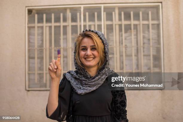 Voters head to polling stations to cast their vote for the Iraqi parliamentary election on May 12, 2018 in Erbil, Iraq. Citizens are voting in the...