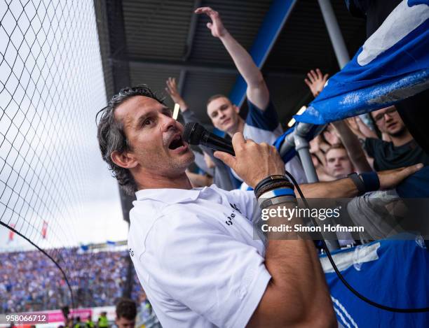 Head coach Dirk Schuster of Darmstadt celebrates winning with supporters after the Second Bundesliga match between SV Darmstadt 98 and FC Erzgebirge...